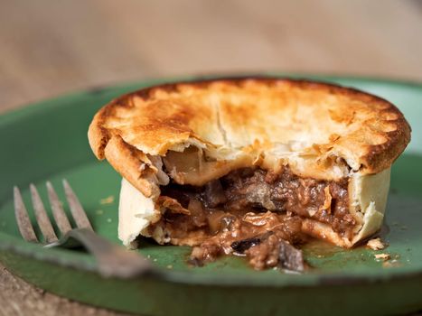 close up of rustic meat and mushroom pie