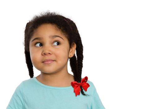 Close up Curious Four-Year Old African American Girl Looking to the Side Against White Background.