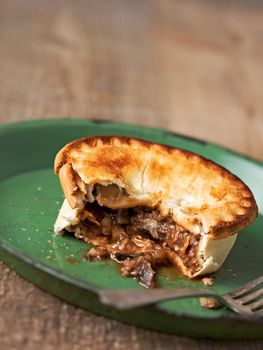 close up of rustic meat and mushroom pie