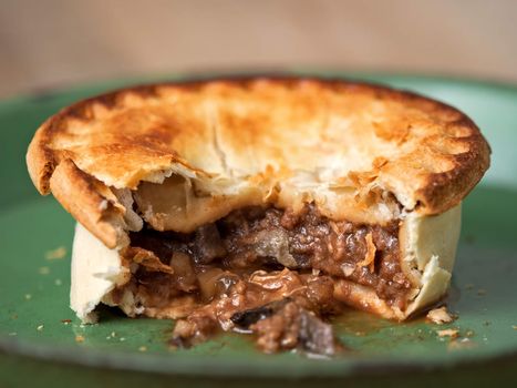 close up of rustic meat and mushroom pie