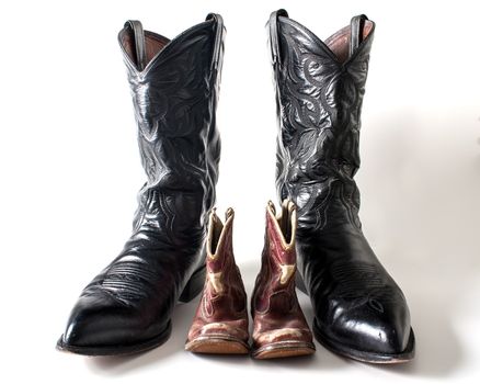 Showing the boots of a father and son next to each other