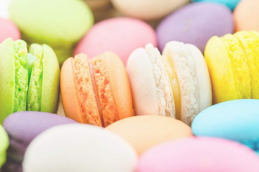 Soft vintage traditional french colorful macarons in a rows in a box