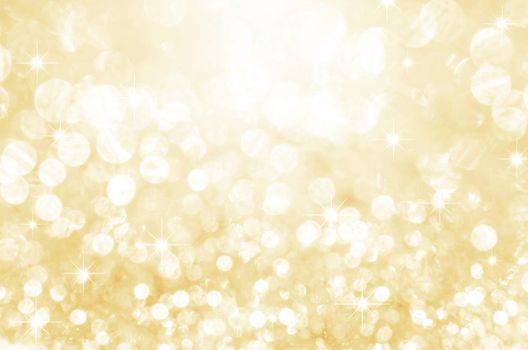 Gold festive glitter background with defocused lights.