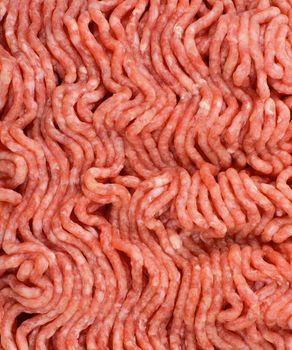 Background of Wavy Raw Minced Pork Meat closeup