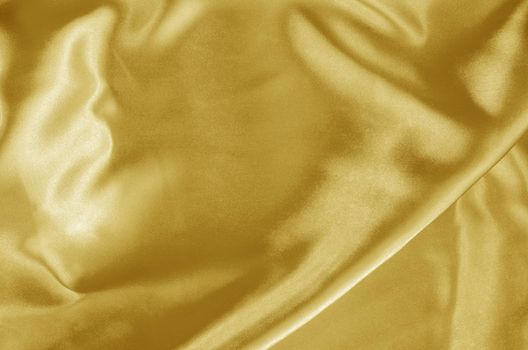 Close up Gold Fabric silk texture for background.