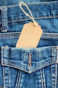 Blank brown tag price in pocket blue jean.