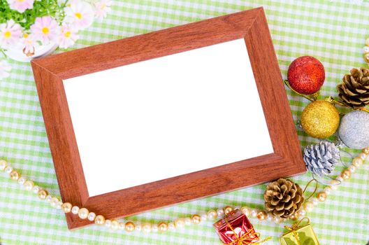 Wooden photo frame and christmas decoration with flower on beautiful background. Save clipping path.