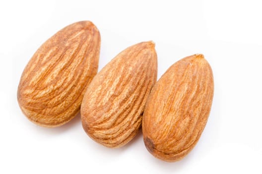 Close up Whole almonds on a white background.