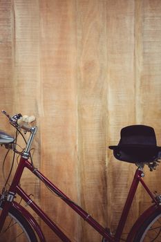 Close up view of a bicycle against wooden background