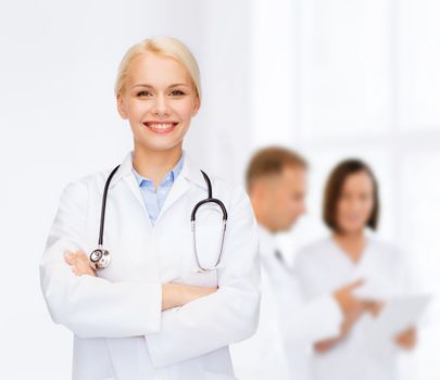 healthcare and medicine concept - smiling female doctor with stethoscope