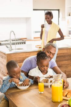 Casual happy family having breakfast in the kitchen