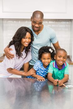 Happy family in the kitchen at home