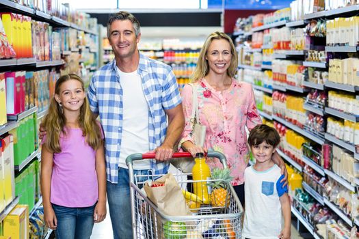 Portrait of happy family at the supermarket