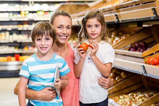 Young family doing some shopping at supermarket