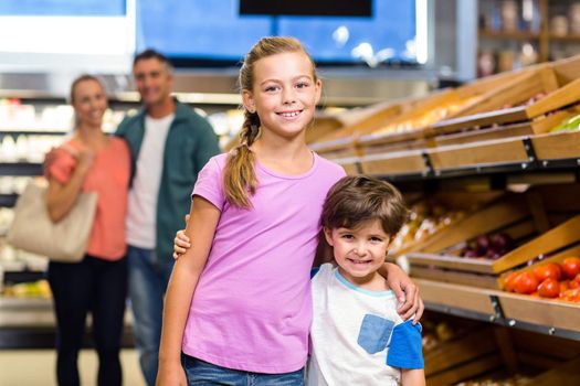 Young family doing some shopping at supermarket