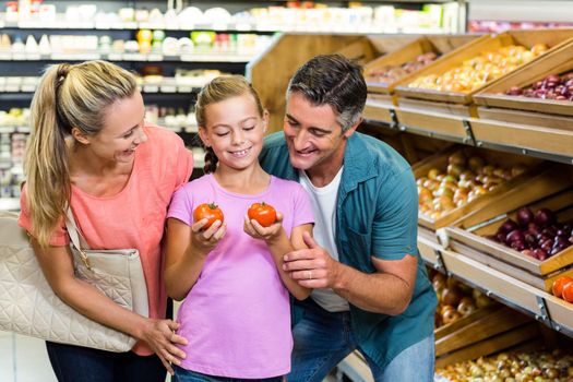 Young family doing some shopping at supermarket