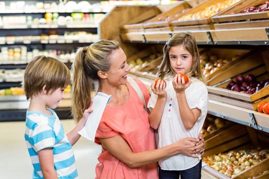 Young family doing some shopping at supermarket