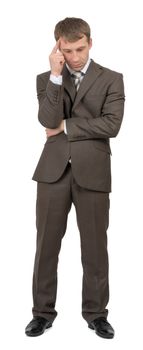 Thinking businessman looking down on isolated white background