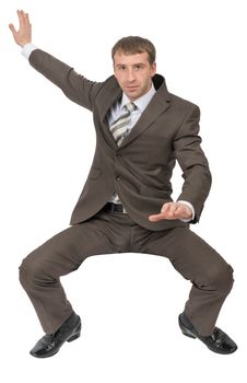 Businessman sitting on empty space and looking at camera on isolated white background