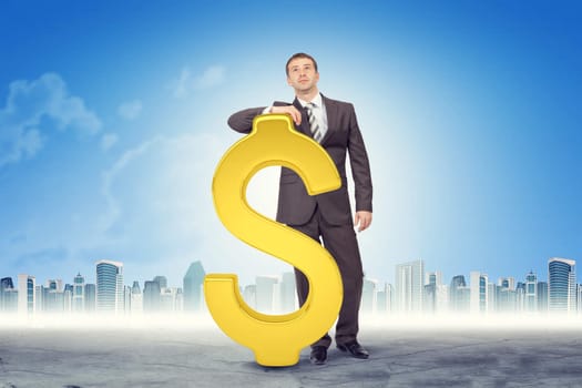 Businessman leaning on dollar sign on cityscape background