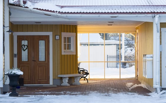 Entrance to House in Winter with snow.