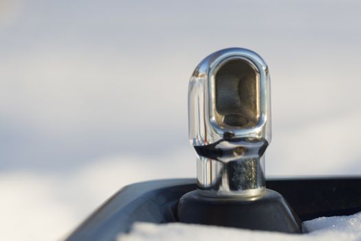 Drinking fountain with Snow and white/grey background.