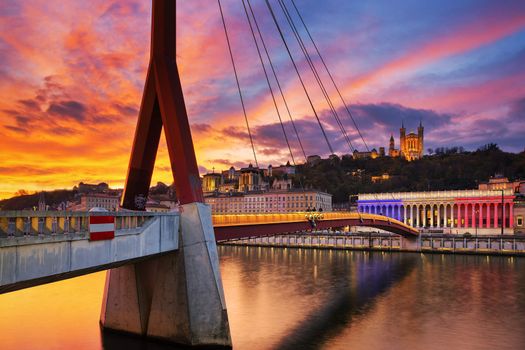 View of footbridge on Saone river at sunset, Lyon, France.