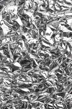 Silver foil, high reclectance background texture.