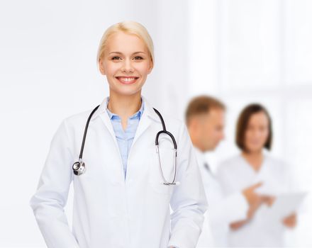 healthcare and medicine concept - smiling female doctor with stethoscope