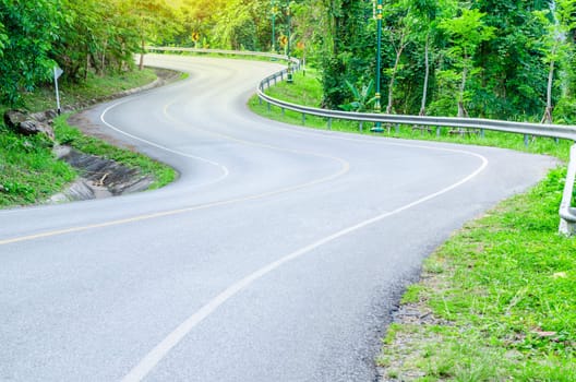 Road on mountain in country, S-shape.