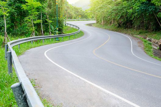 Road on mountain in country, S-shape.