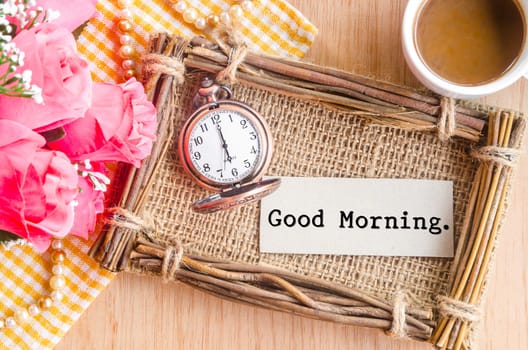 Good morning card and pocket watch with a cup of coffee