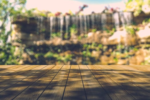 Beautiful sunlight in the autumn forest with wood planks floor, nature background, bokeh background