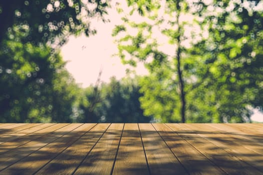 Beautiful sunlight in the autumn forest with wood planks floor, nature background, bokeh background