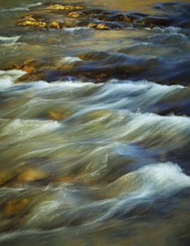 abstract seasonal background evening autumn river with rapids