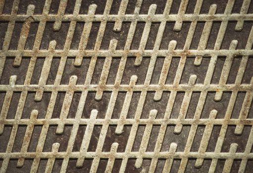 abstract background or texture rusty iron lid with a pattern