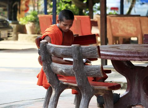 Siem Reap, Cambodia - April 07, 2014: Unidentified young monk of temple, Angkor Wat, Siem Reap on November 7, 2014, Cambodia. 