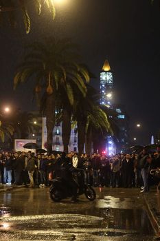 TUNISIA, Tunis: A crowd has formed as police and medical crews are on the scene of an explosion in Tunis, Tunisia that killed at least 12 people aboard a military bus on November 24, 2015. The bus was transporting members of the presidential guard when a bomb exploded just before 5pm local time; and was reportedly parked near the street Habib Bourguiba, where Tunisia's Interior Ministry and French Embassy are situated.