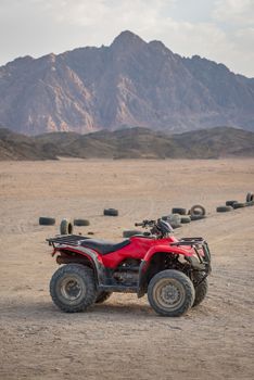 ATV Quad Bike in the desert and background beautiful  stone mountain.