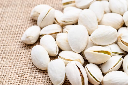 Close up Pistachios on sack background.