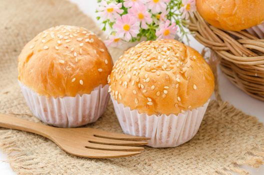 bread bun with white sesame and on sack background.