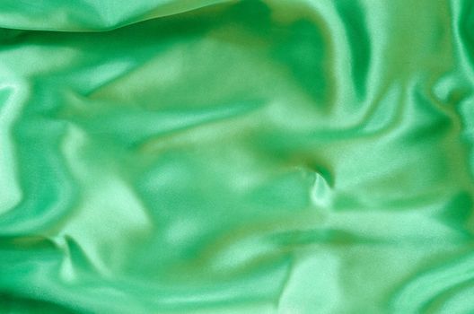 Emerald or green silk fabric texture or background