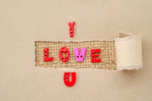 I love you alphabet on brown paper and sack background. Love concept.