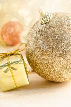 Close up golden ball christmas decoration with light bokeh.