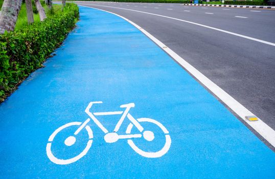 bicycle symbol lane with blue background on the road.