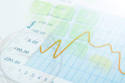 Clocks with finance graph and calculator business concept