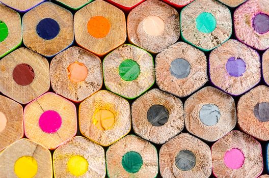 Texture of many wooden colored pencils