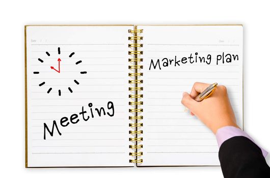 Hand of business man writing meeting market plan and clock symbol in open notebook on white background.