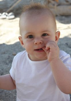 Portrait of Little baby girl on the beach