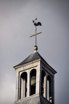 Rooster and cross on top of a catholic church in France